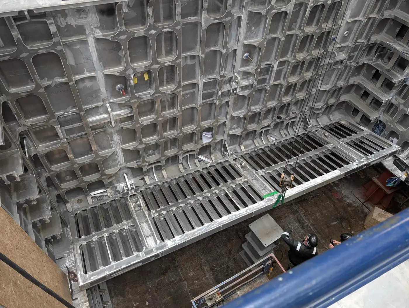 Moonpool door leaf being lowered into position inside the vessel moonpool